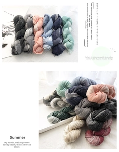 Detail of twisted cotton linen scarves showing various colors and white stripe pattern