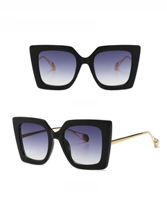 Front and 45-degree side view of vintage oversized cat-eye sunglasses with pearl details
