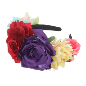 Detailed close-up of realistic red, purple, and yellow faux rose and mum floral headband