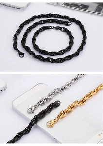 Detail of twisted curb chain necklaces in gold, silver, and black with lobster clasps