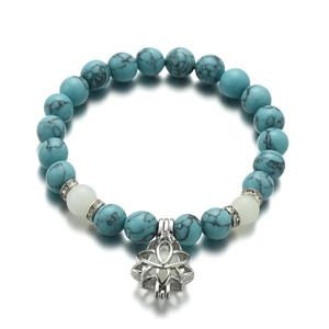 Luminous lotus flower charm yoga bracelet with turquoise beads and silver metal accents