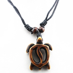 Vintage-style faux bone sea turtle pendant necklace with adjustable black cord cord