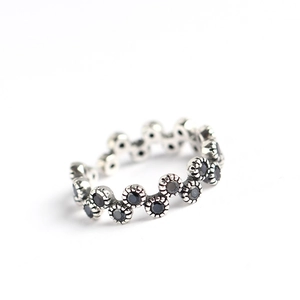 S925 sterling silver wave ring with black zircon flower patterns in a polished finish