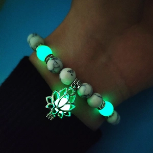 Luminous turquoise yoga beads bracelet with glowing lotus pendant in the dark detail