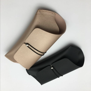 Litchi pattern PU leather sunglass pouch with elastic drawstring in black and gold