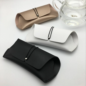 Three-color leather sunglasses cases in rose gold white and black with elastic closure