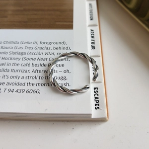 Macro view of vintage 925 sterling silver braided twisted rope open ring for women