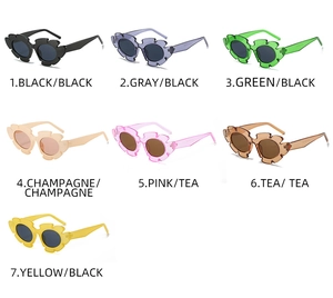 Grid display of seven colorful flower shaped sunglasses in various jelly tints