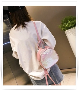 Kids sequin mini backpack detail view, cute pink unicorn design with shiny glitter finish.