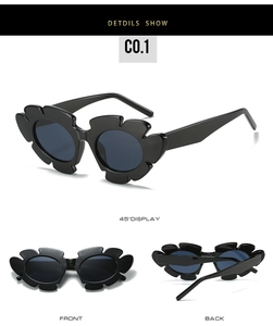 Detailed close-up of black flower shaped frame sunglasses with dark lenses and durable hinges