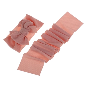 Detail view of pink waffle knit baby headbands with bow showing soft fabric texture