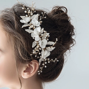 Elegant gold bridal hair comb with handmade white flowers and cream pearls for wedding