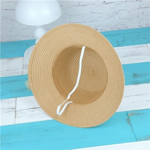 Summer woven sun hat with wide brim and elegant lace flower detail in khaki straw