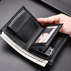 Short black vertical bi-fold men wallet showing internal card slots and coin pocket details