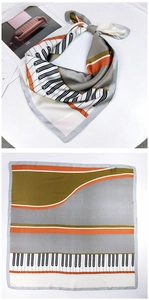 Detail of artistic 70cm square scarf with piano key pattern and geometric blocks