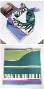 Detail view of square silk scarf featuring piano key print and green purple color blocks