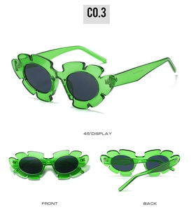 Three-angle views showing details of green flower-shaped frame and dark circular lenses