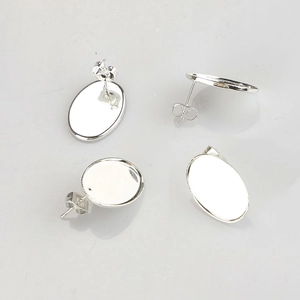 Detailed view of four silver stainless steel oval teardrop earring settings for DIY jewelry