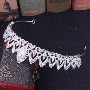 Silver leaf alloy tiara with rhinestones and marquise crystal on a vintage jewelry box