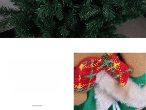Detail of plush Christmas tree ornament with festive red, green and yellow plaid bow tie