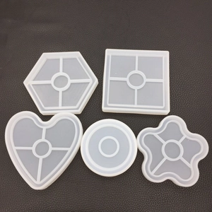 Five geometric silicone molds for DIY resin coasters in heart, hexagon and round shapes