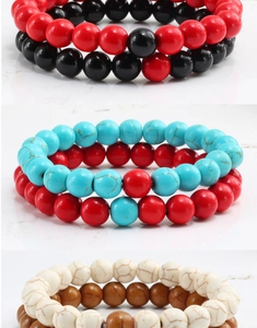Detailed macro view of 8mm beaded bracelets in turquoise and matte black stone