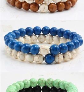 Detail of beaded bracelet set with marble texture stones in blue green and brown colors