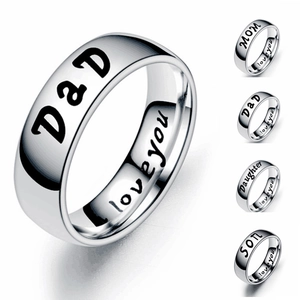 Detailed view of silver stainless steel rings with MOM, DaD, SON, and DAUGHTER engravings