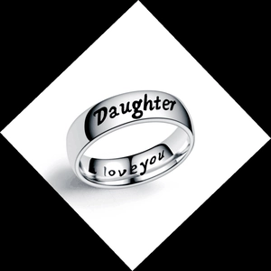 Close-up of silver steel ring with Daughter and I love you engraving on white background