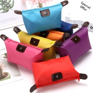 Nylon cosmetic bags in various bright colors with leather snap flap and zipper closure