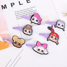 Detailed view of six colorful cartoon girl character hair clips on a simple card background