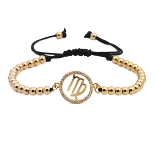 Detail of Virgo zodiac charm bracelet with gold beads and micro-pave cubic zirconia