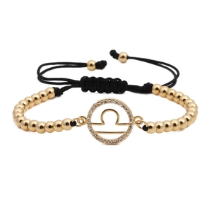 Adjustable Libra zodiac bracelet featuring gold beads and sparkling white zirconia