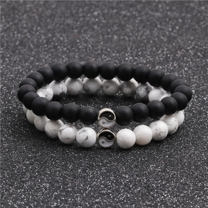 Yin Yang distance bracelets for couples featuring white turquoise and matte black beads