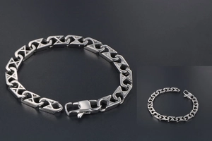 Macro shot of silver mesh link bracelet with spring clasp and polished finish