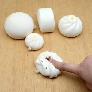 Five-piece set of slow-rebound simulated steamed bun stress relief squishy toys on wood