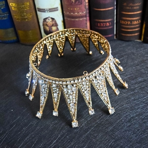 Detail showing vintage gold spiked bridal crown with glittering rhinestones and gemstones