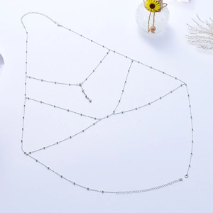 Exaggerated silver multilayer body chain with shimmering beads and fringe tassels for beachwear