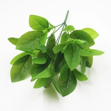 Close-up of artificial fern leaves with realistic green texture for wedding wall decor