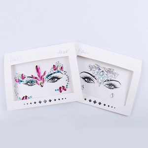 Macro detail of pink and blue face crystal stickers with professional card packaging