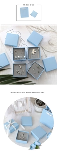 Close-up of sky blue jewelry gift boxes and matching carry bags for luxury storage