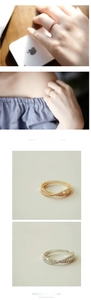 Macro detail of criss-cross 18k rose gold ring with micro-pave crystals for women
