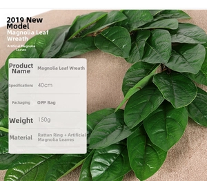 Detail view of 40cm artificial magnolia leaf wreath with 150g rattan base and green foliage