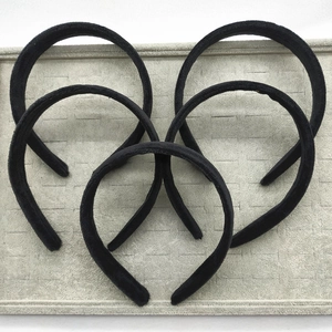 Set of five black velvet headbands on a jewelry tray for DIY hair accessory making