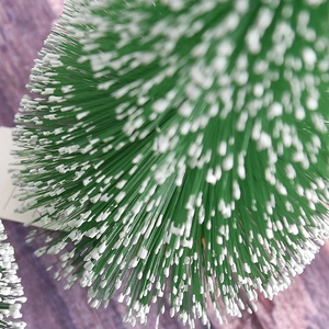 Mini green snowy bottle brush Christmas tree with white frosting for table decoration