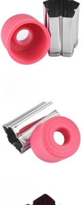 Macro detail of star cookie cutter with ergonomic pink grip and stainless steel edge