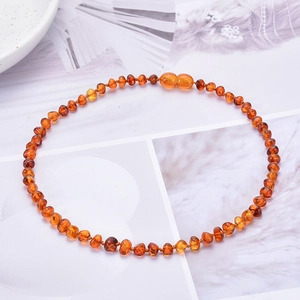 Multicolor Baltic amber beaded necklace for babies featuring honey and cherry amber beads