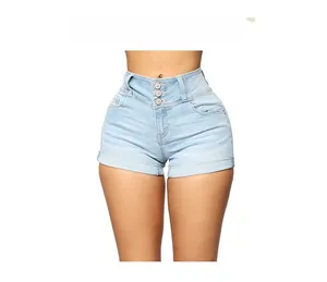 Detail of light blue high waisted denim shorts featuring a triple button closure and cuffed hem