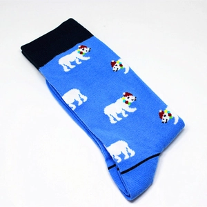 Close-up of knit crew socks featuring festive polar bear patterns in sky blue and black