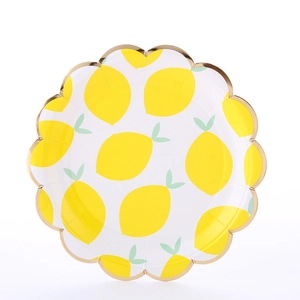 Detailed top view of a round lemon pattern paper plate with elegant scalloped gold edges